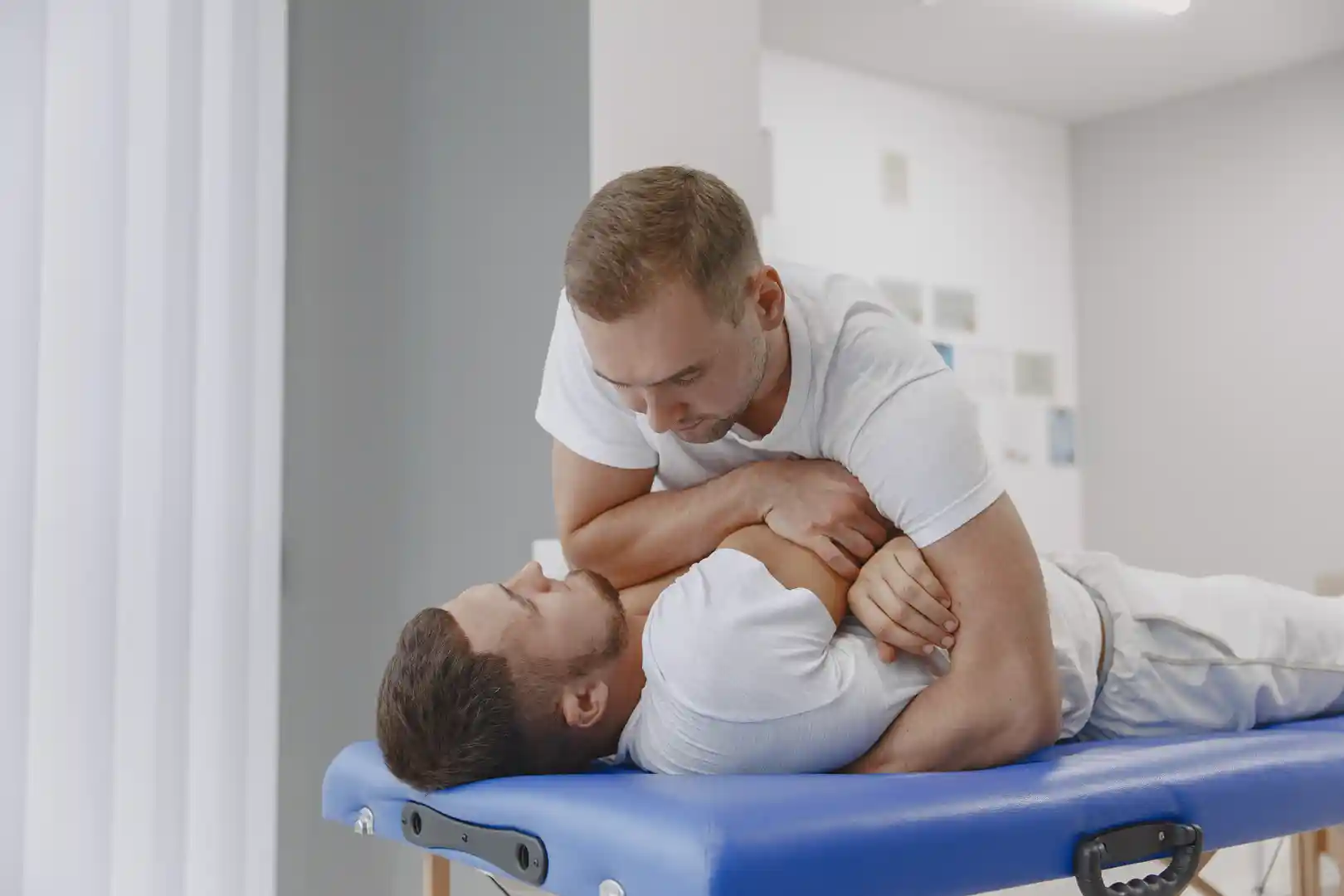 man-medical-office-physiotherapist-is-rehabilitating-back Sports Physiotherapy in Dubai