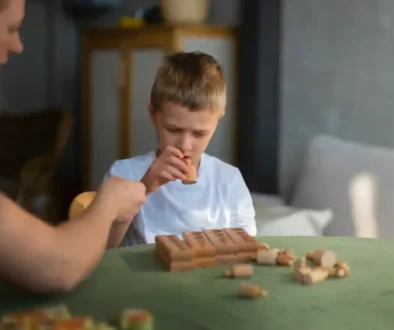 mother-playing-with-her-autistic-son-using-toys